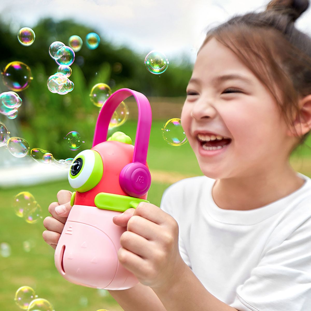 Friendly pink monster design bubble machine with sturdy handle for easy carrying – One Two Play